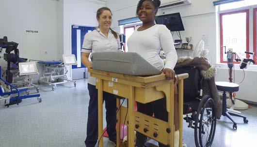 A patient and clinician working together during rehabilitation
